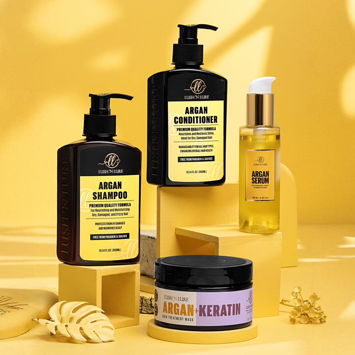 "LUSH 'N LURE Argan Shampoo, Conditioner, Hair Mask, and Serum displayed together with natural argan nuts and leaves, showcasing their hydrating formulas for soft, healthy hair."