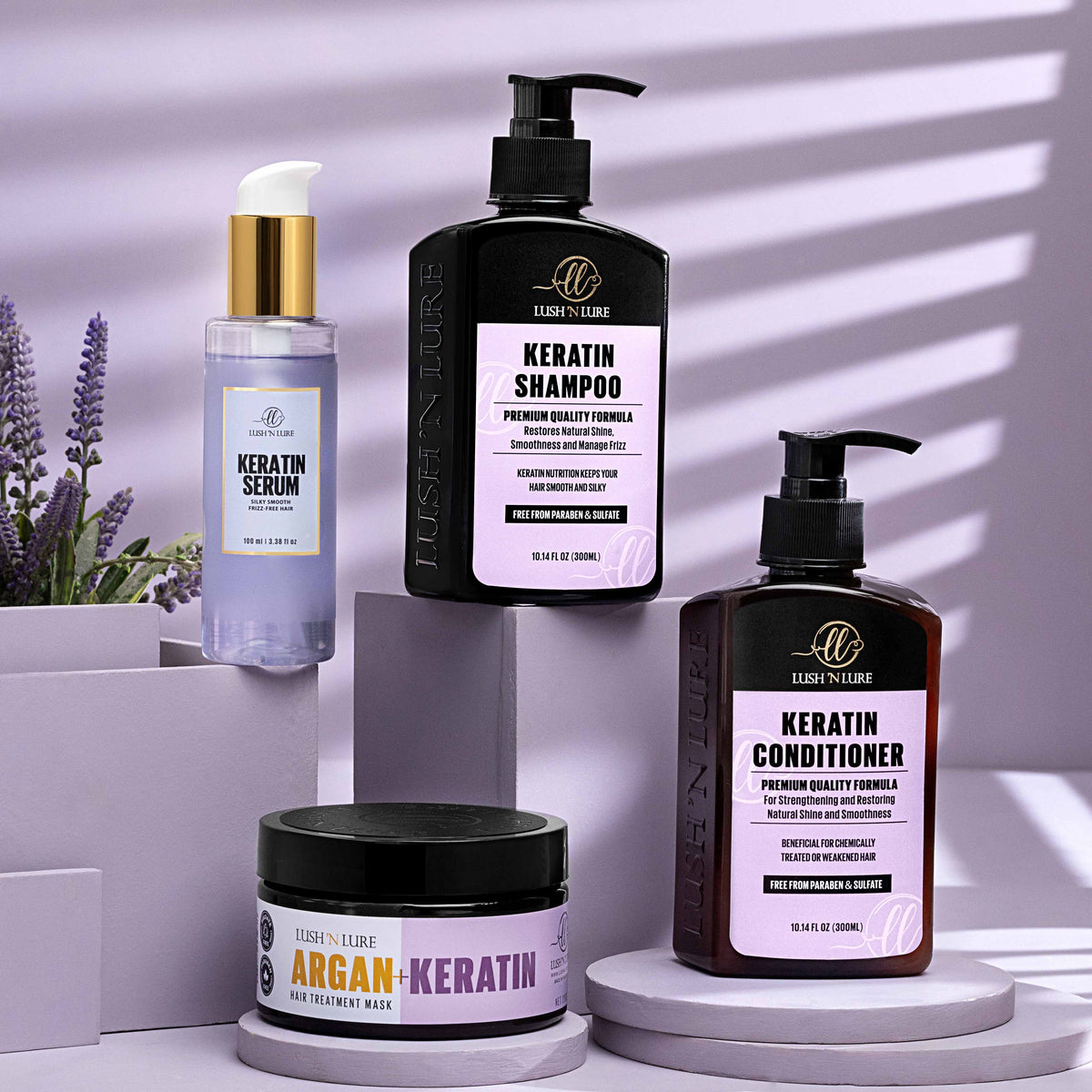 "LUSH 'N LURE Keratin Shampoo, Conditioner, Serum, and Hair Mask bundle arranged together with smooth fabric and natural elements, highlighting their frizz-fighting formula for sleek, manageable hair."