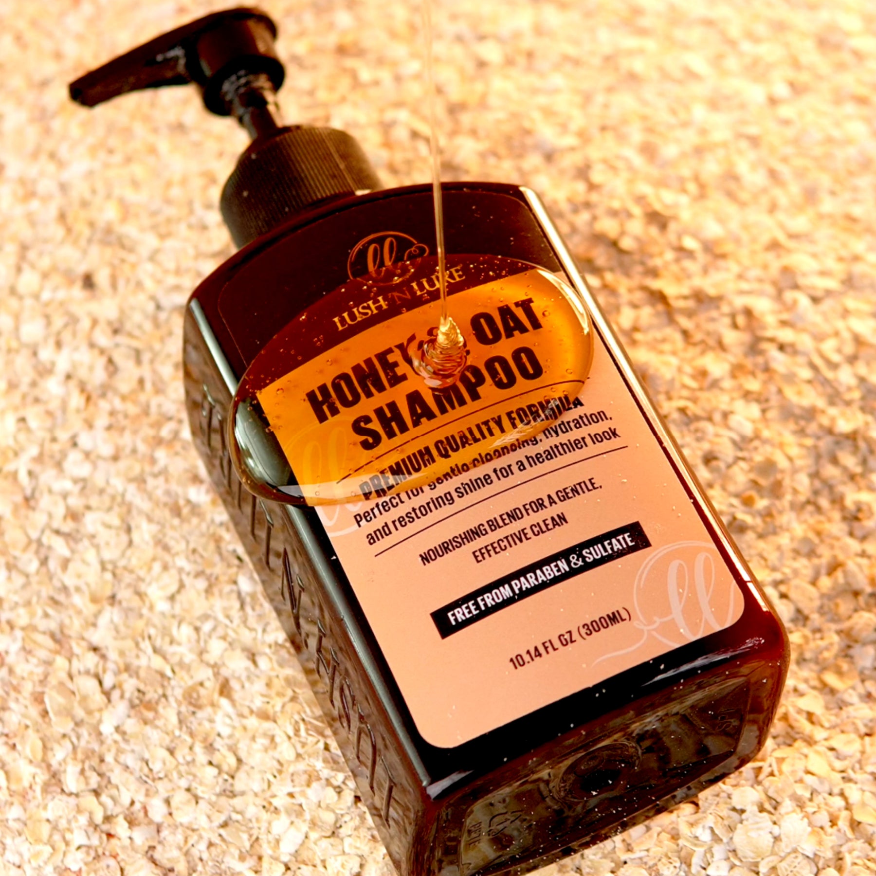 LUSHNLURE Honey & Oat Shampoo bottle, highlighting a nourishing formula enriched with natural honey and oats to cleanse, hydrate, and enhance hair's softness and shine