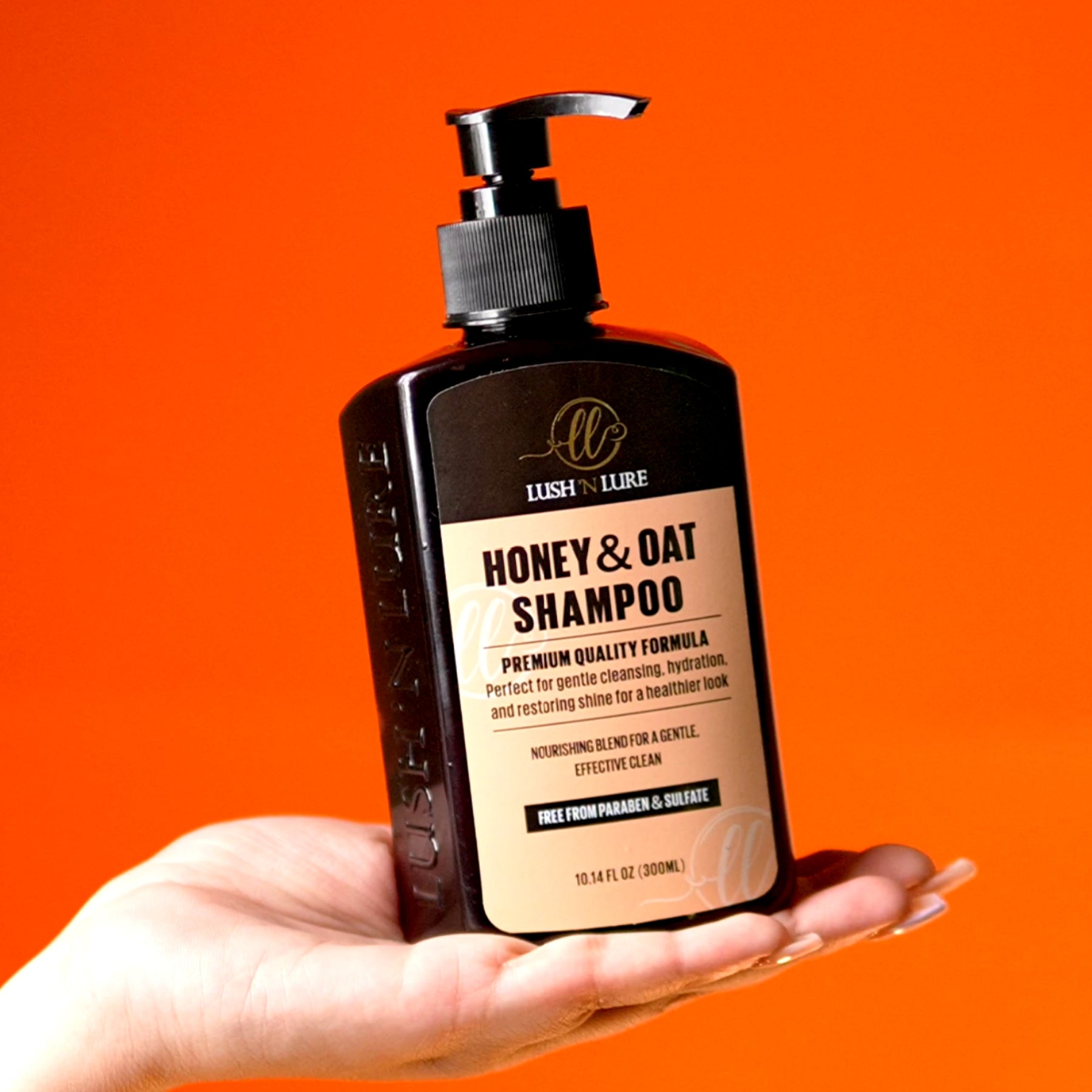 "Model gently lathering LUSHNLURE Honey & Oat Shampoo in her hair, highlighting the rich, creamy texture of the shampoo. The product nourishes and hydrates hair, leaving it soft, smooth, and naturally shiny."