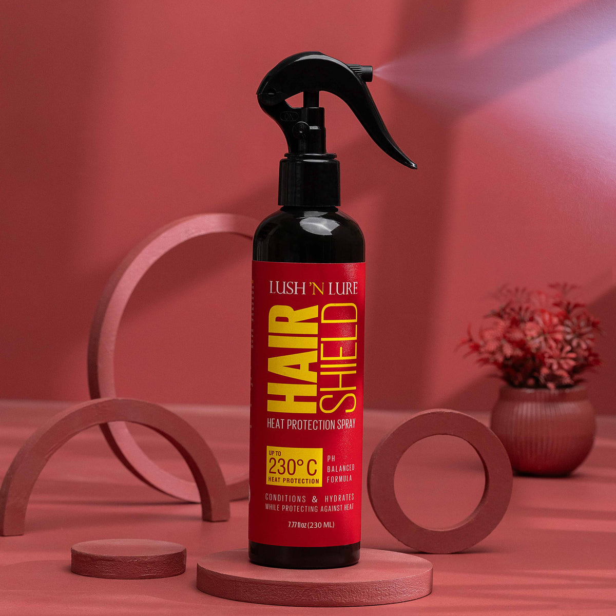 "LUSH 'N LURE Heat Protection Spray with a temperature rating of up to 230°C, displayed against a sleek background, emphasizing its formula designed to shield hair from heat damage while styling."
