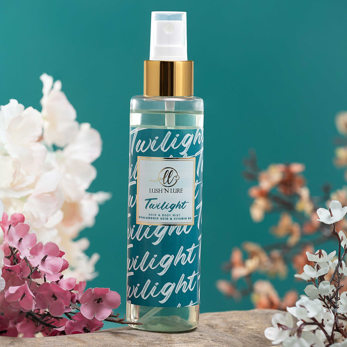 Skincare hair & body mist bottle labeled 'Twilight' with flowers on a teal background
