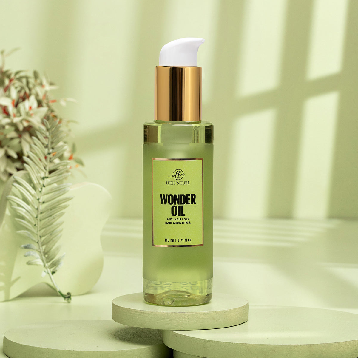 "LUSH 'N LURE Wonder Oil for Hair Growth and Fall, elegantly displayed with natural ingredients and botanical elements, showcasing its nourishing formula designed to strengthen hair and reduce hair fall."