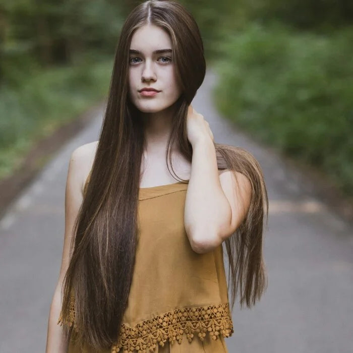 Girl showing healthy hair, results of using Lush'N Lures Hair Strengthening Mask