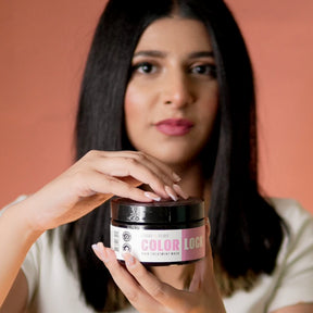 "Model applying LUSHNLURE Color Lock Hair Mask to her hair, highlighting its smooth, rich texture. The mask is formulated to deeply nourish and protect color-treated hair, keeping it vibrant, soft, and shiny."