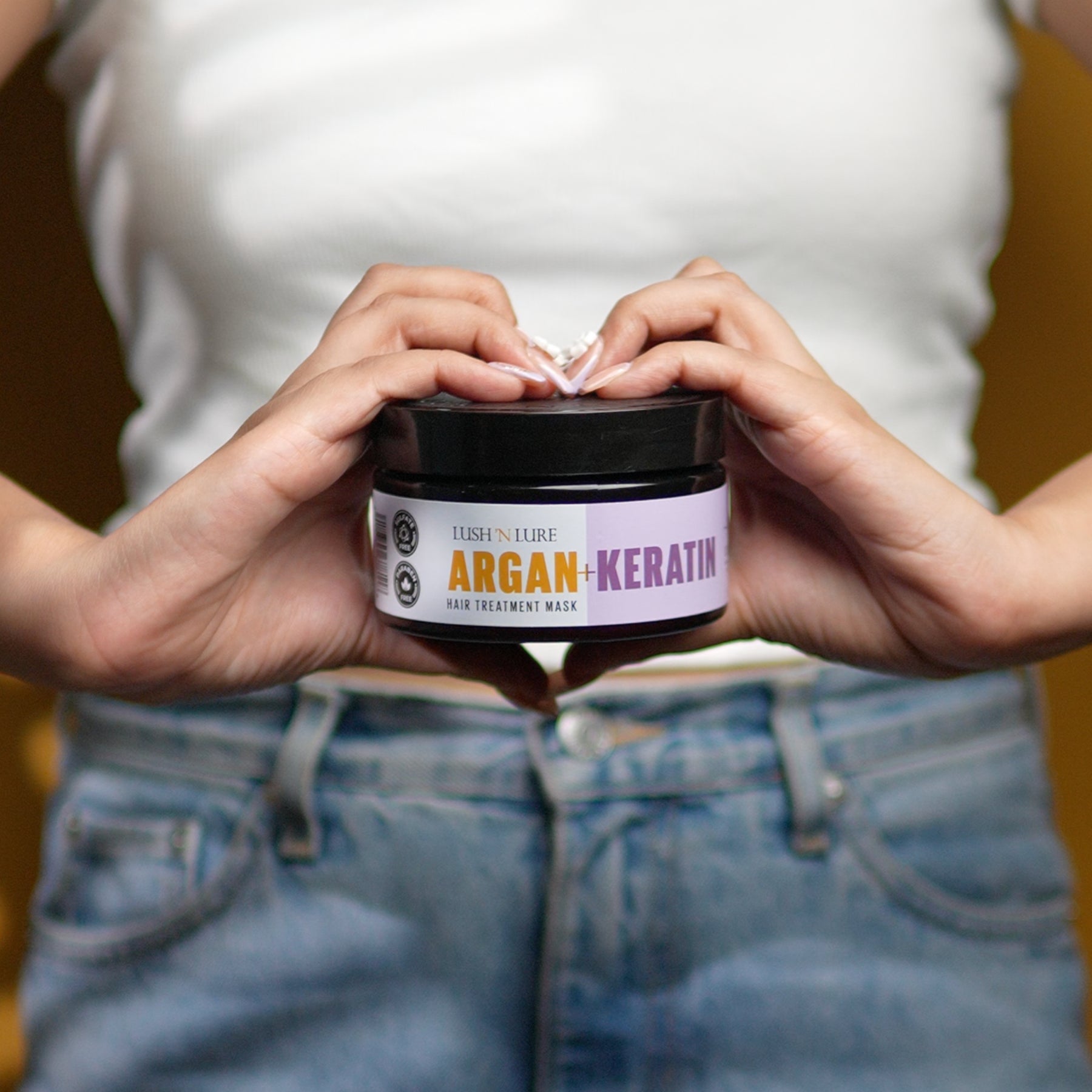 Model showcasing LUSHNLURE Argan & Keratin Hair Mask – a luxurious hair care product designed to deeply nourish, repair, and add shine to hair for a smooth, silky finish.