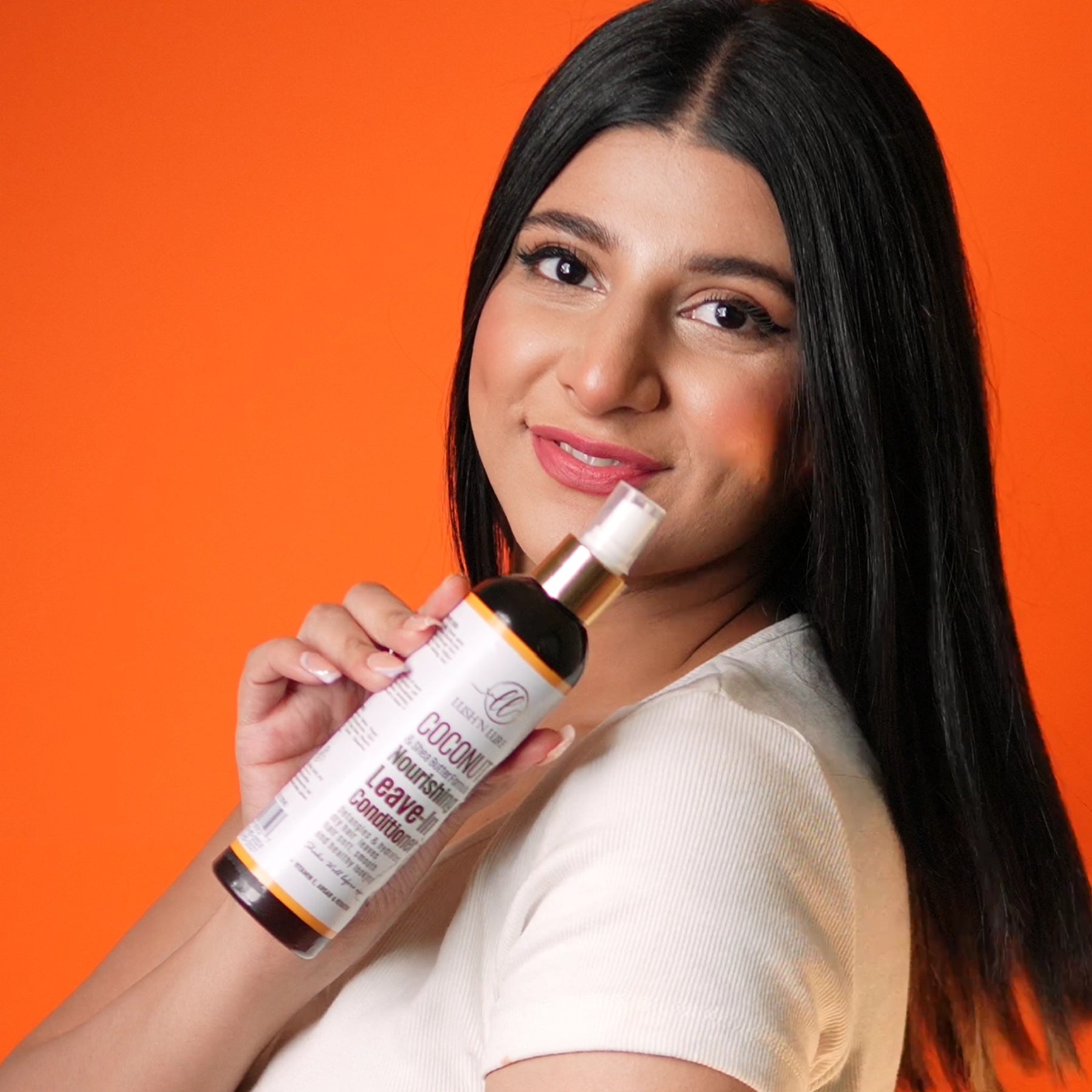 "Model featuring LUSHNLURE Coconut Leave-In Conditioner Spray – a lightweight, hydrating formula infused with coconut to detangle, nourish, and enhance hair's softness and shine."