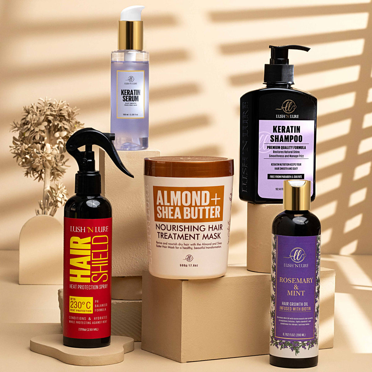 "LUSH 'N LURE Most Loved Products featuring Heat Protection Spray, Keratin Shampoo, Almond Mask, Keratin Serum, and Rosemary Oil arranged together, showcasing their effective formulas for healthy, nourished hair."